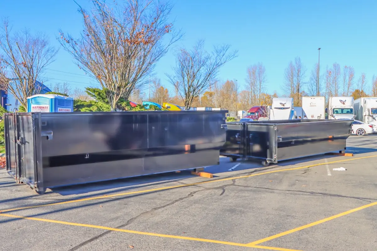 Professional dumpster rental service with roll-off container on residential driveway in Shepherdsville